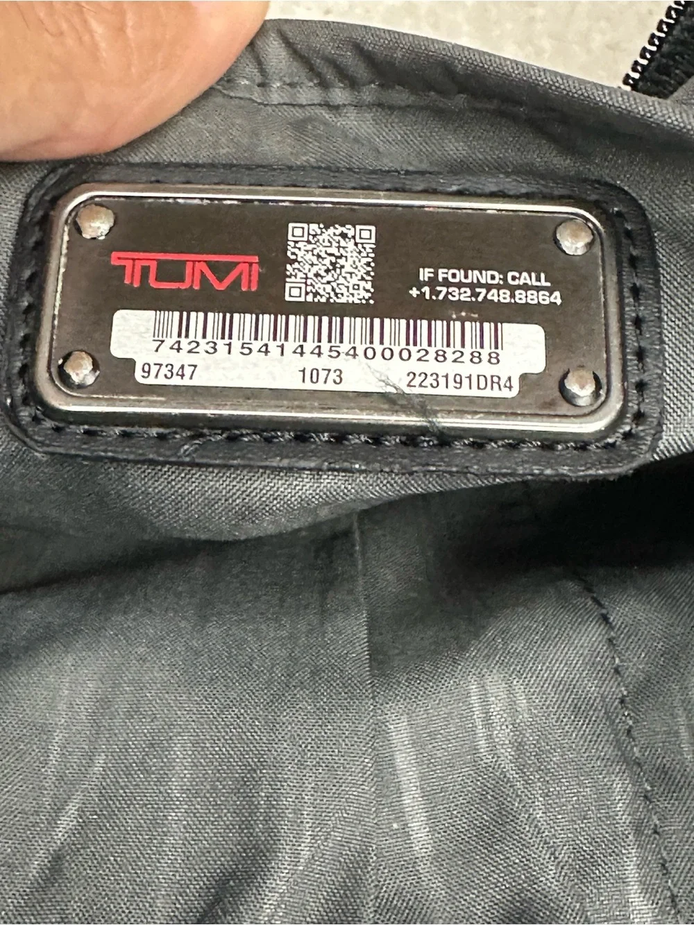 Tumi Black Toiletry Bag with Red Accents